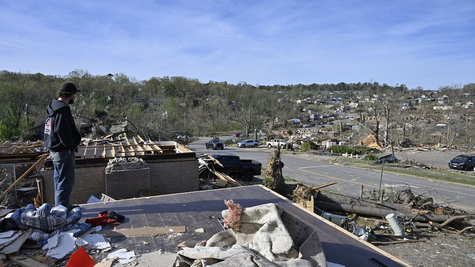Arkansas tornado victim looks at destruction