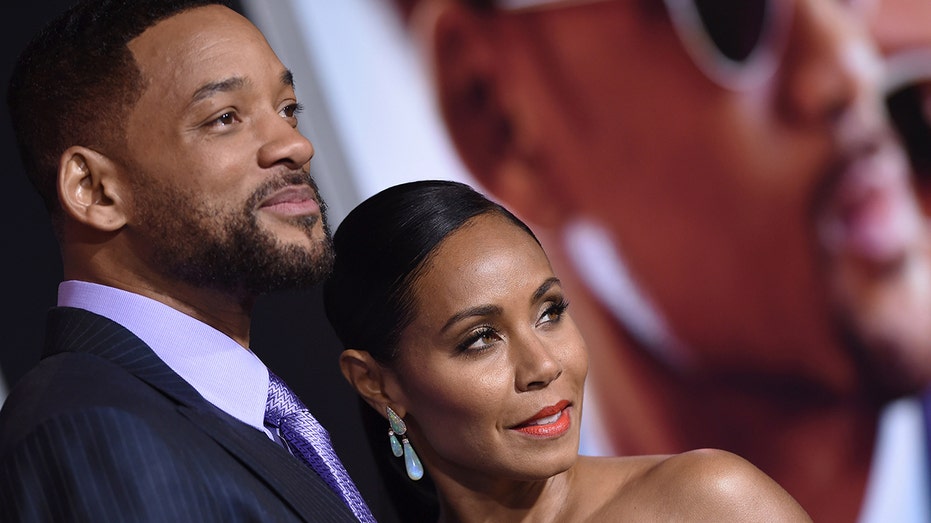 Will Smith and Jada Pinkett Smith embracing