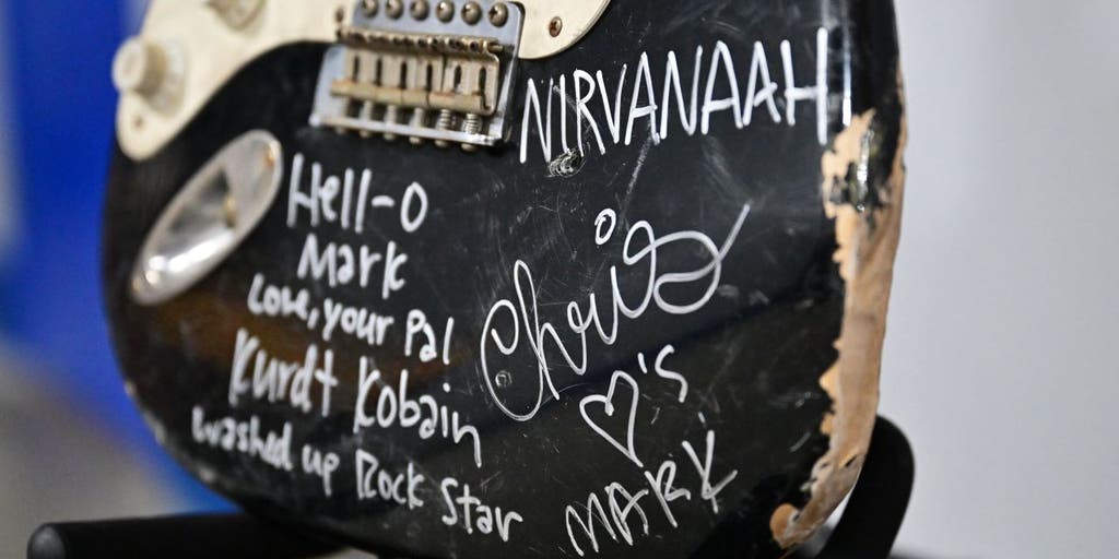 Kurt Cobain's smashed, autographed guitar sold to Nirvana