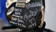 Kurt Cobain's smashed, autographed guitar sold to Nirvana fan for almost $600K