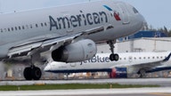 American Airlines raises checked luggage fees