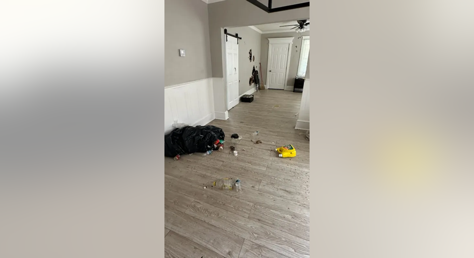 Damaged living room after squatters leave