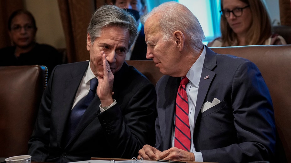 Joe Biden talks with Antony Blinken