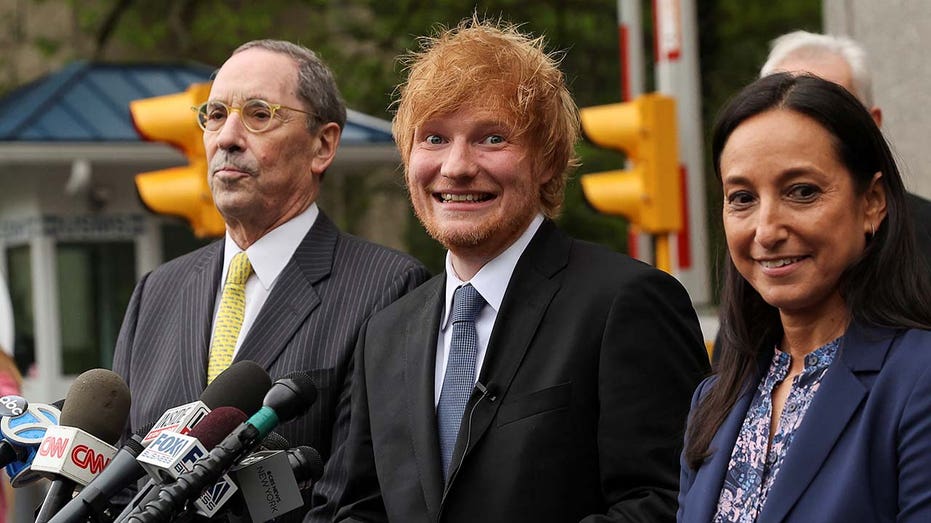 Ed Sheeran reacts, as he speaks to the media, after after his copyright trial