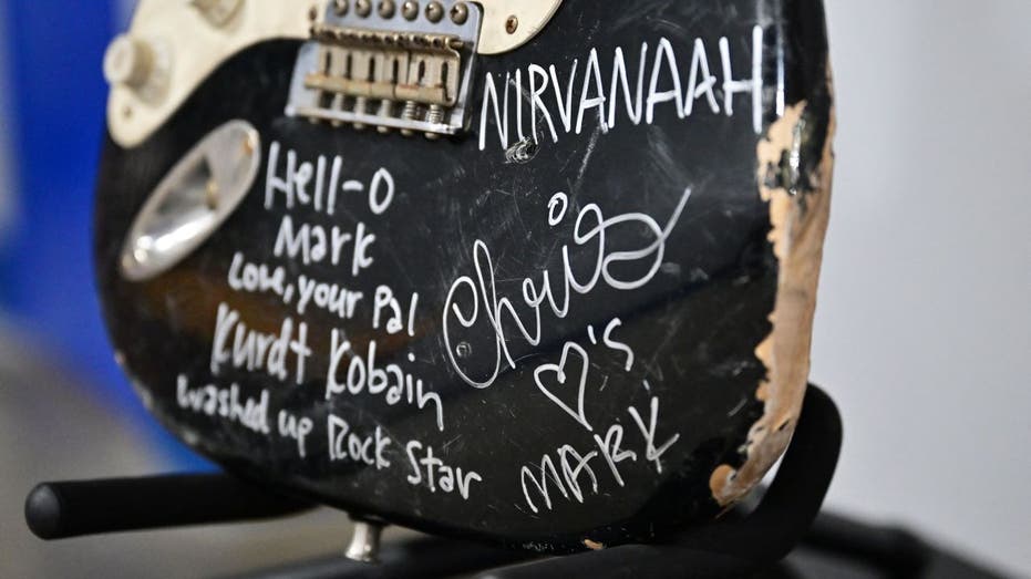 Kurt Cobain signature on smashed guitar
