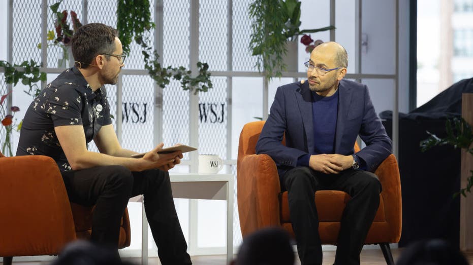 Photo of Chris Mims and Demis Hassabis