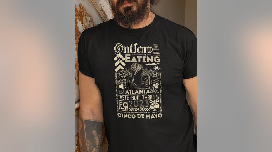 Moe's Southwest Grill t-shirt on man.