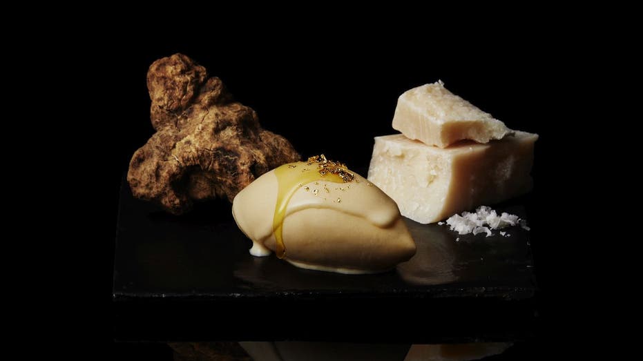 Cellato's Byakuya gelato presented next to truffle and Parmigiano Reggiano.