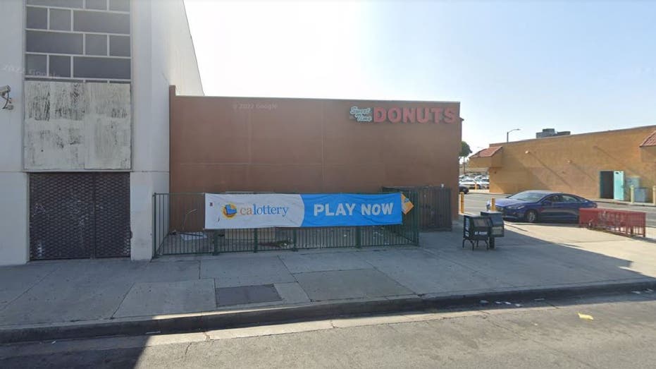 Exterior of Sweet Time Donuts with a California Lottery sign.