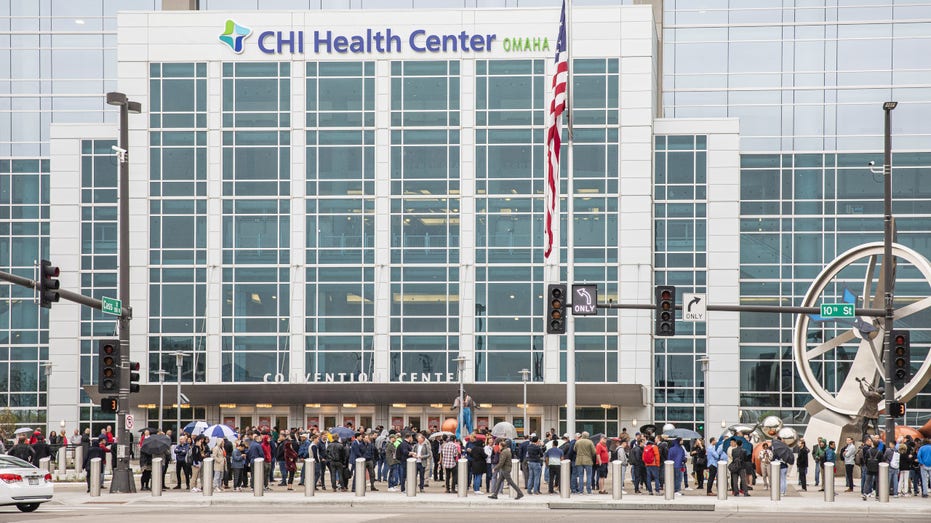 Attendees wait in line to enter a shareholders shopping day