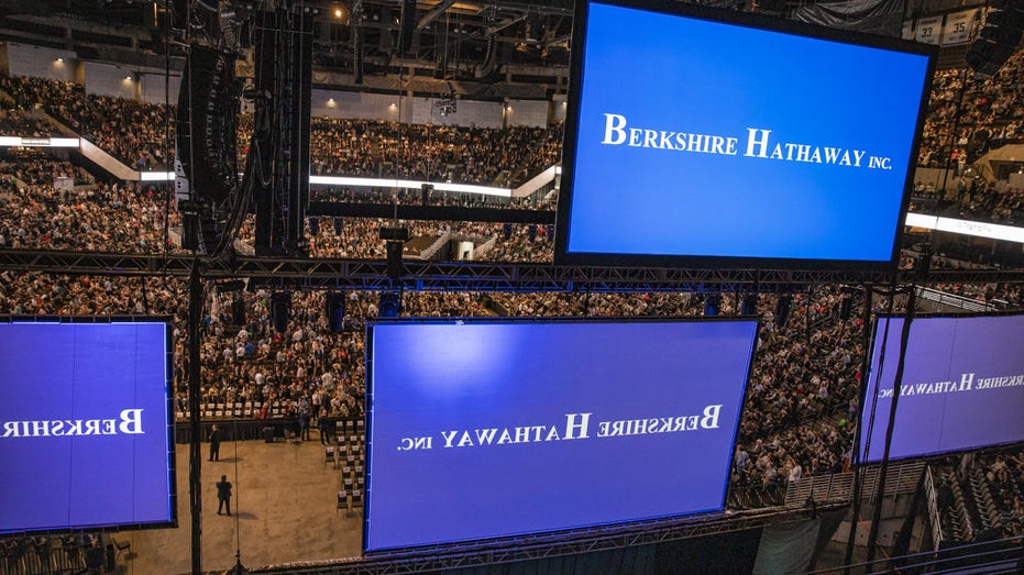 Attendees arrive at the auditorium of the CHI Health Center during the Berkshire Hathaway annual meeting in Omaha, Nebraska, US, on Saturday, May 6, 2023.