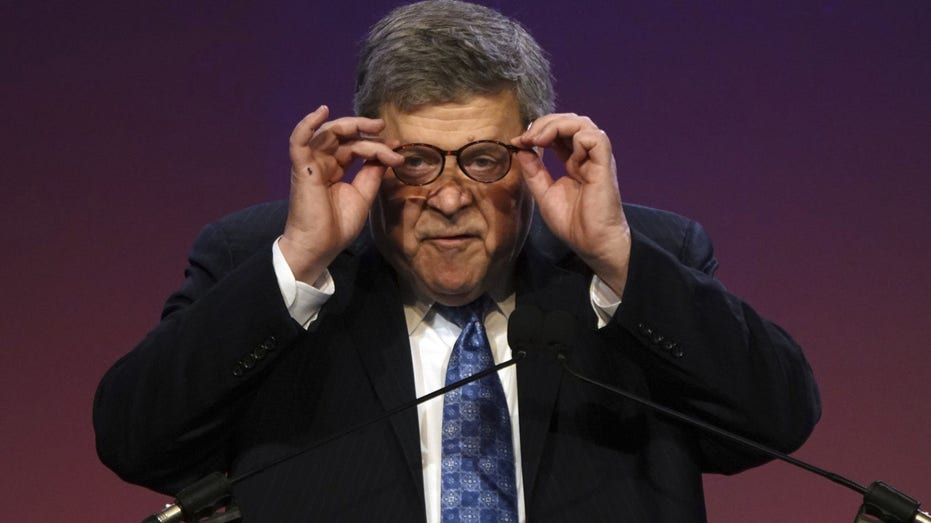 Bill Barr adjusting glasses