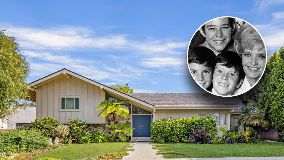 Outside the Brady Bunch house with a photo insert of the actors