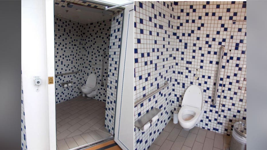 A toilet and tile walls inside the Harmony of the Seas top deck restroom