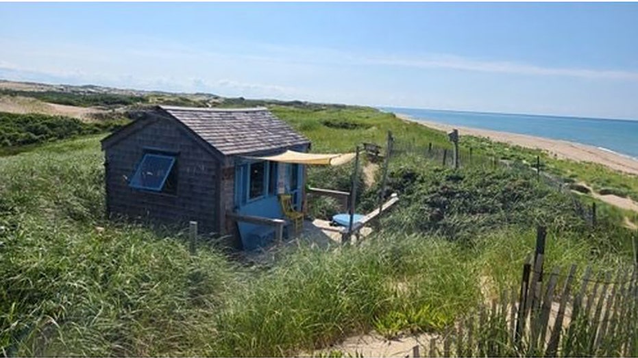 A dune shack next to the water