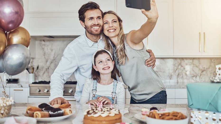 Parents celebrating with daughter.