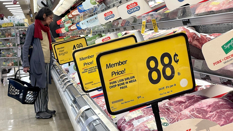 Customer buying meat at Safeway store