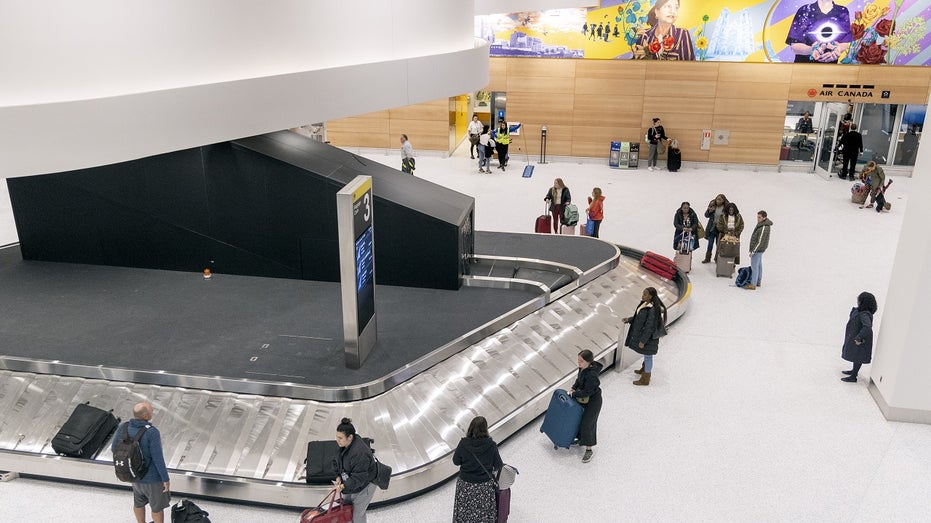 travelers waiting inside Newark airport