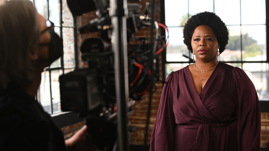 Patrisse Cullors looking into a camera