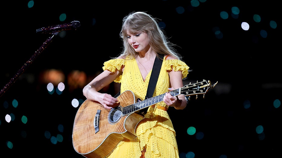 Taylor Swift playing the guitar