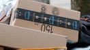 FILE PHOTO: Amazon packages are pictured on a delivery cart in the Manhattan borough of New York City, New York, U.S., December 10, 2021.  REUTERS/Carlo Allegri