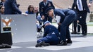 U.S. President Joe Biden is helped up after falling during the graduation ceremony at the United States Air Force Academy, just north of Colorado Springs in El Paso County, Colorado, on June 1, 2023. 