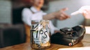 A tip jar on the counter at a coffee shop. - Fox Business News