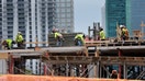 MIAMI, FLORIDA - MAY 05: Construction workers on a job site on May 05, 2023 in Miami, Florida. A report by the Bureau of Labor Statistics showed the US economy added 253,000 jobs in April.  (Photo by Joe Raedle/Getty Images)