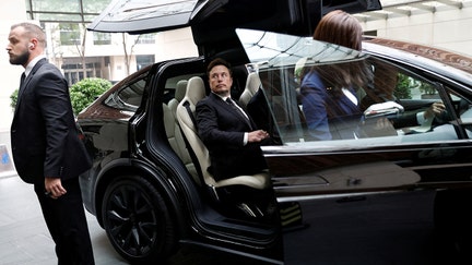 Tesla Chief Executive Officer Elon Musk gets in a Tesla car as he leaves a hotel in Beijing, China May 31, 2023.