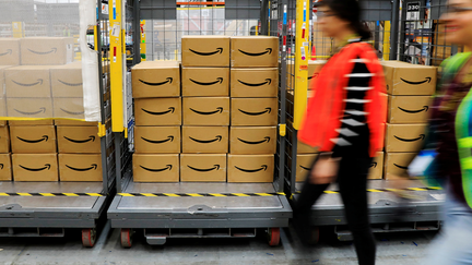 FILE &mdash; Packages are seen at an Amazon warehouse. The company is facing a class-action lawsuit alleging discrimination against pregnant workers. - Fox Business News