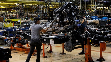 Workers put engines on the frame as Ford Motor Co. fuel powered F-150 trucks under production at their Truck Plant in Dearborn, Michigan on September 20, 2022. - Construction crews are back at Dearborn, remaking Ford's century-old industrial complex once again, this time for a post-petroleum era that is finally beginning to feel possible. The manufacturing operation's prime mission in recent times has been to assemble the best-selling F-150, a gasoline-powered vehicle - Fox Business News