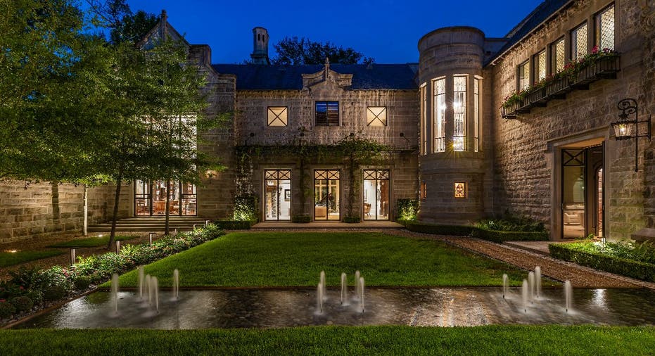 The Lodge in Hunters Creek's fountain courtyard at night.