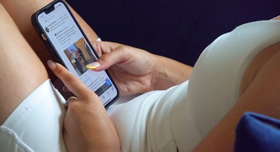 Woman scrolling on phone