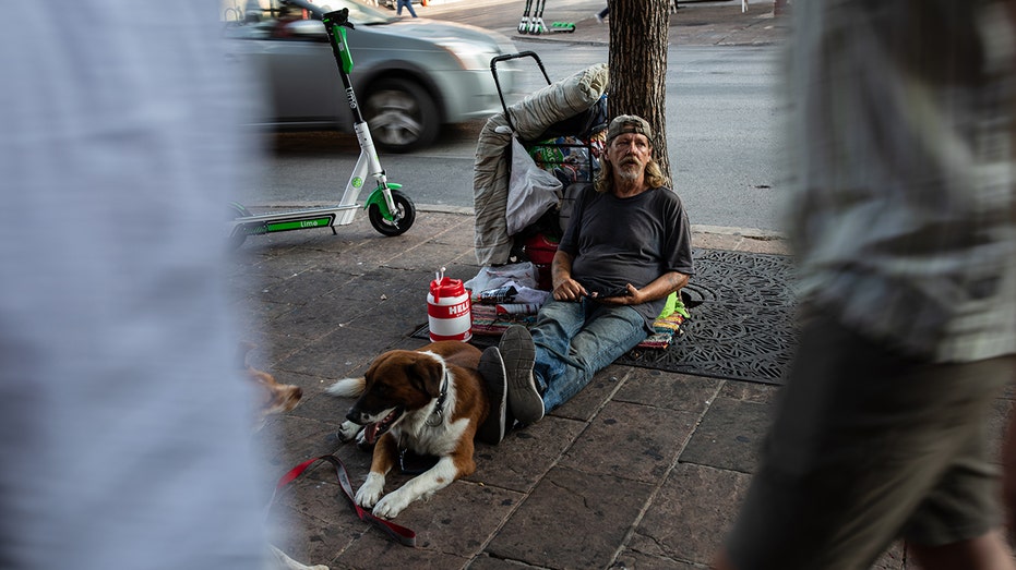 Homeless man sits on Austin street