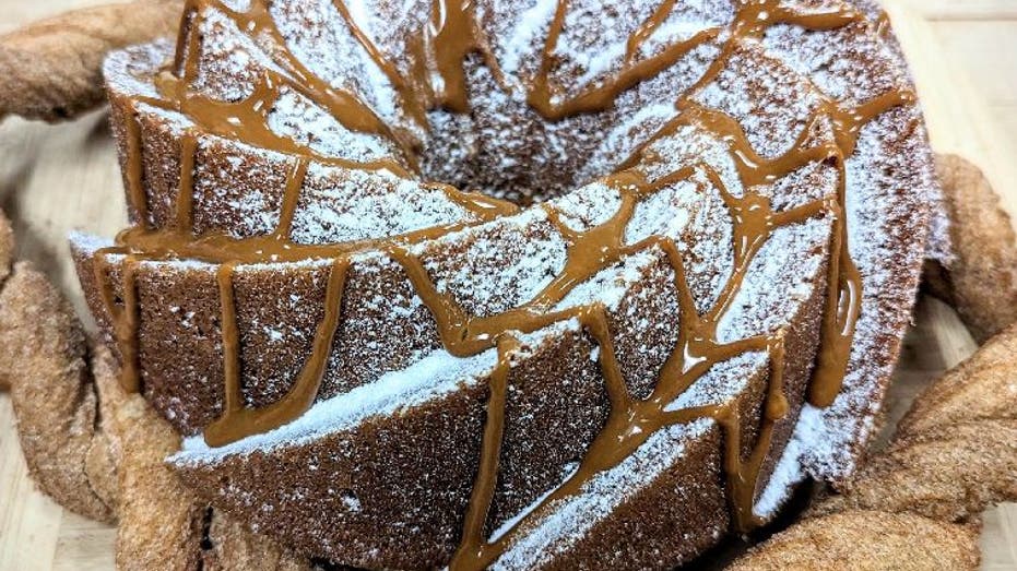 Bakery Street Churro Bundt Cake on display on a rustic wood background.