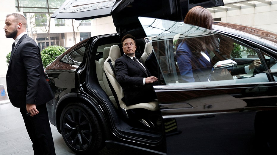 Teslas CEO Elon Musk successful a car successful Beijing, China