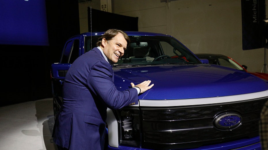 Ford CEO Jim Farley and Ford F-150 Lightning truck