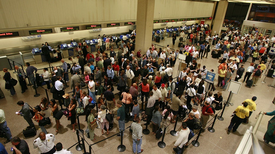 A large crowd of people at the airport