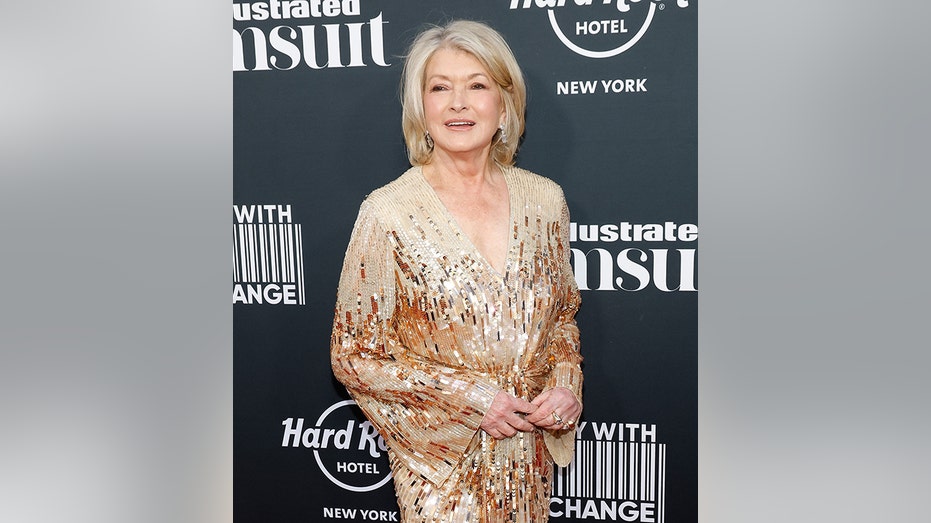 Martha Stewart smiles in a gold sparkly dress for the 2023 Sports Illustrated Swimsuit Launch