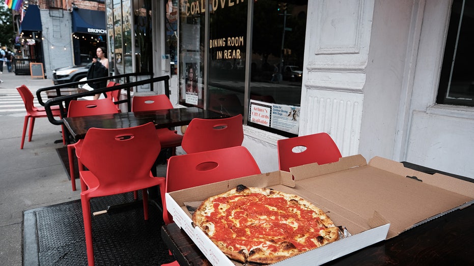 Pizza pie on a table outside a New York City restaurant