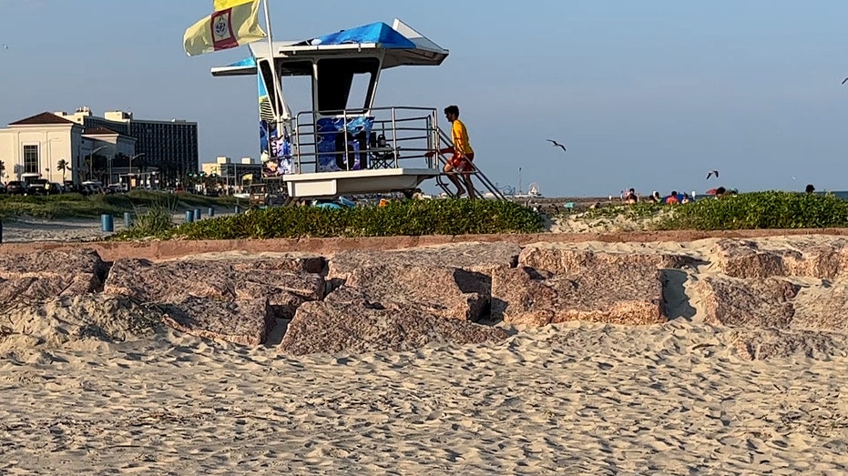 Lifeguard sits in tower