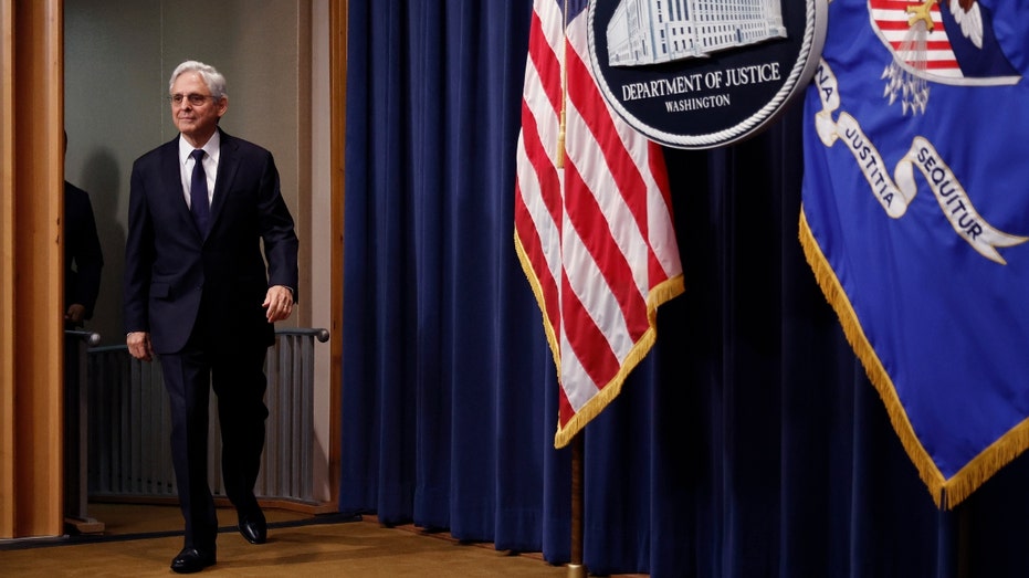 U.S. Attorney General Merrick Garland walks into the room
