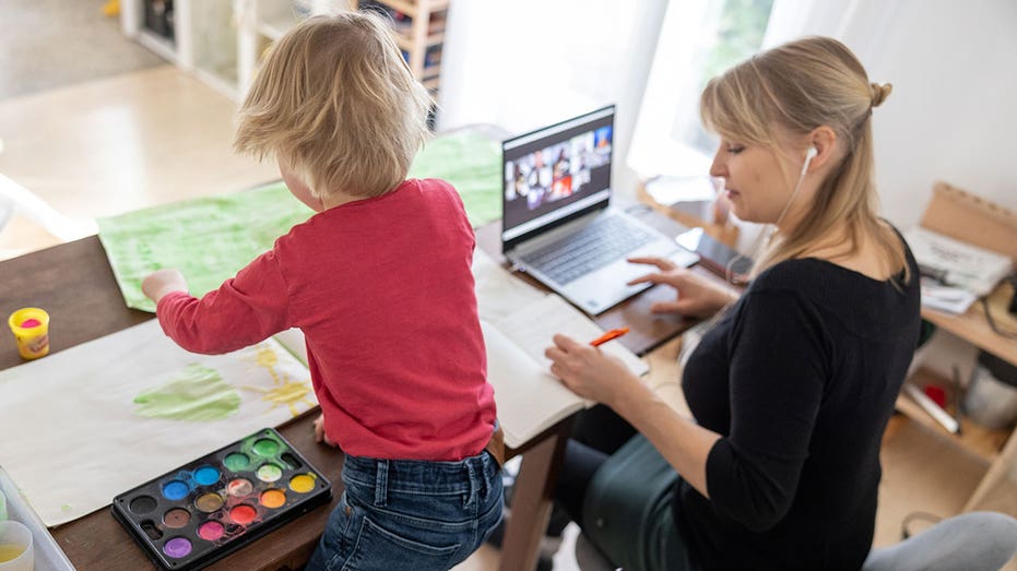 Mom works remote next to son