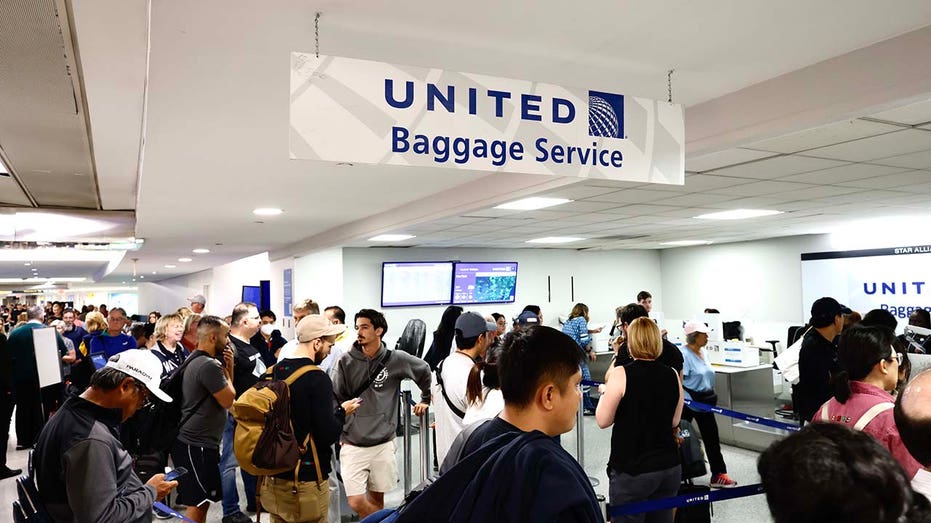 People waiting for their flight reschedule inside of the Newark International Airport