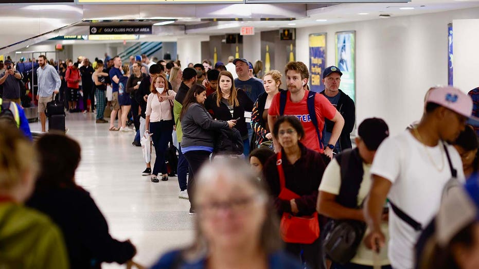 People waiting for their flight reschedule inside of the Newark International Airport