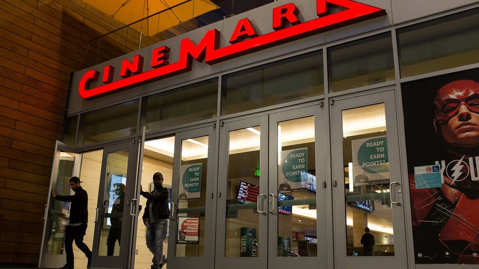 A person exits a Cinemark theater