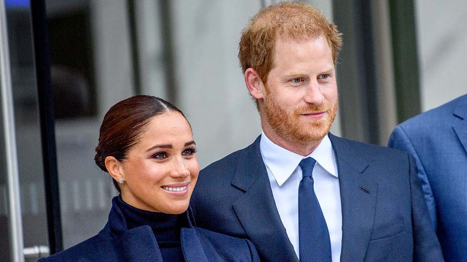 Prince Harry and Meghan Markle smiling