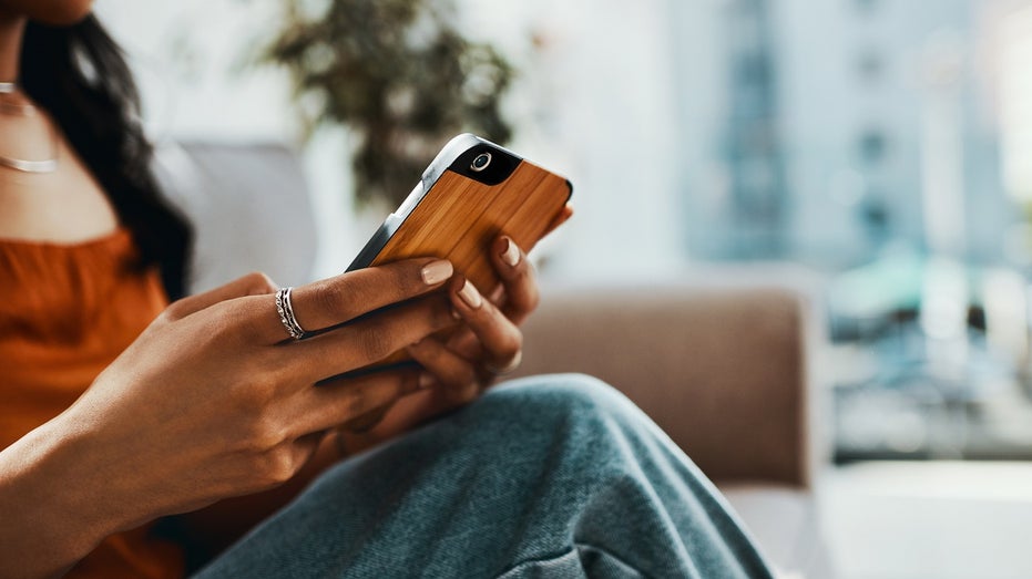 woman holding phone