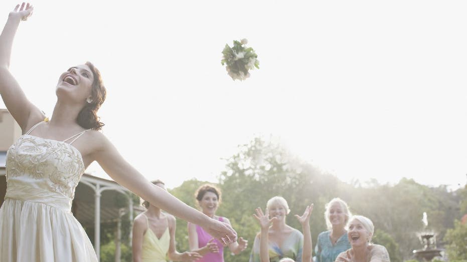 Bride tosses bouquet