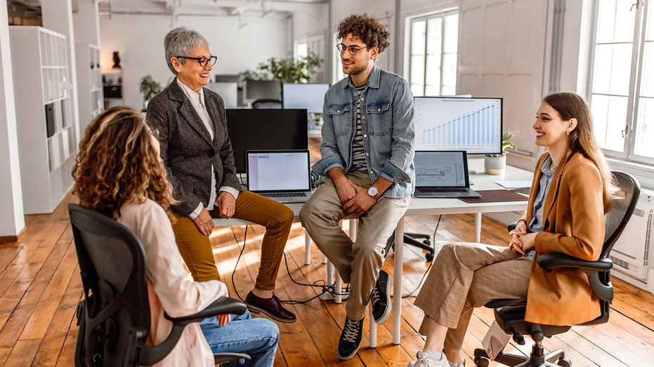 team discusses in an office